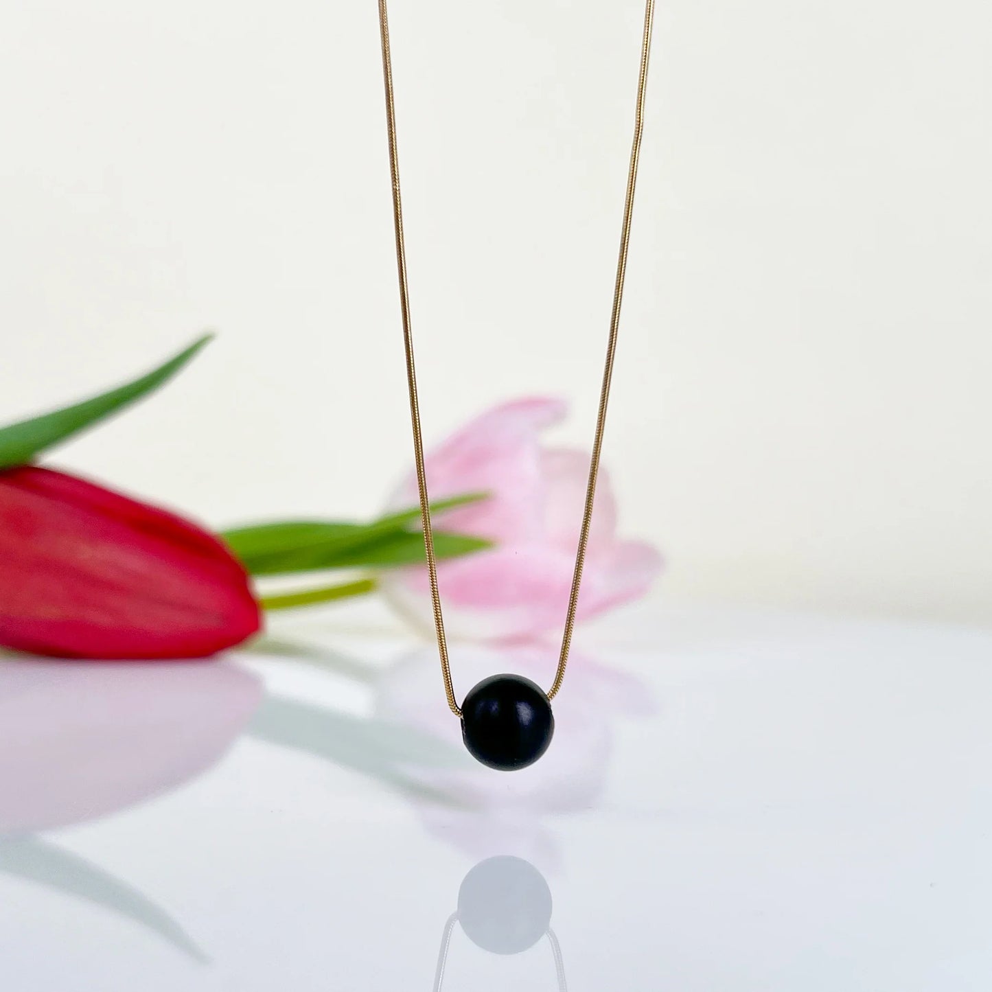 Velvet Dot – Minimalist Matte Black Amber Necklace, 18K gold-plated chain