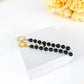Silhouette Flow – Long Black Baltic Amber Earrings, 18K gold-plated