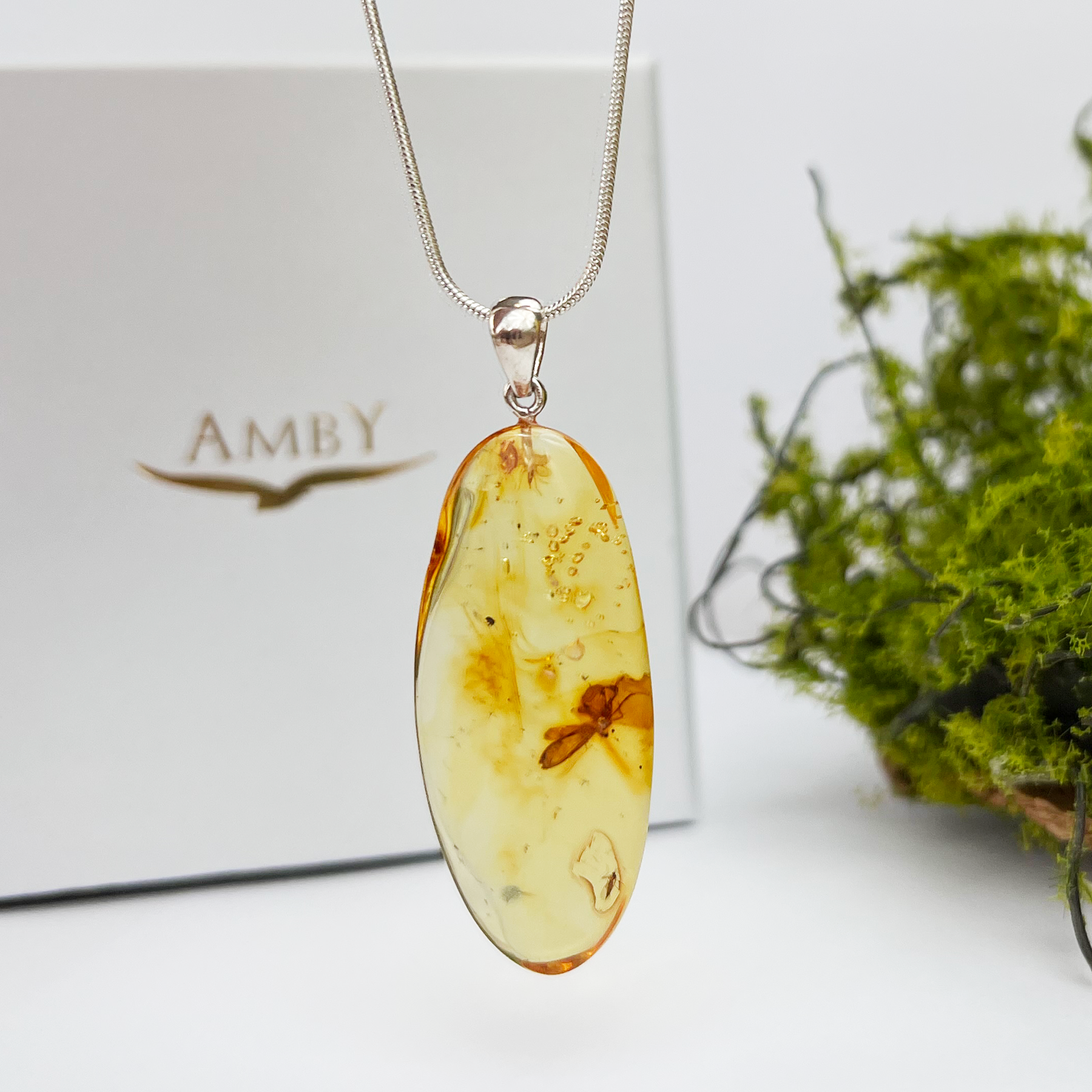 Amber pendant with inclusions "Friendship of spider and fly"
