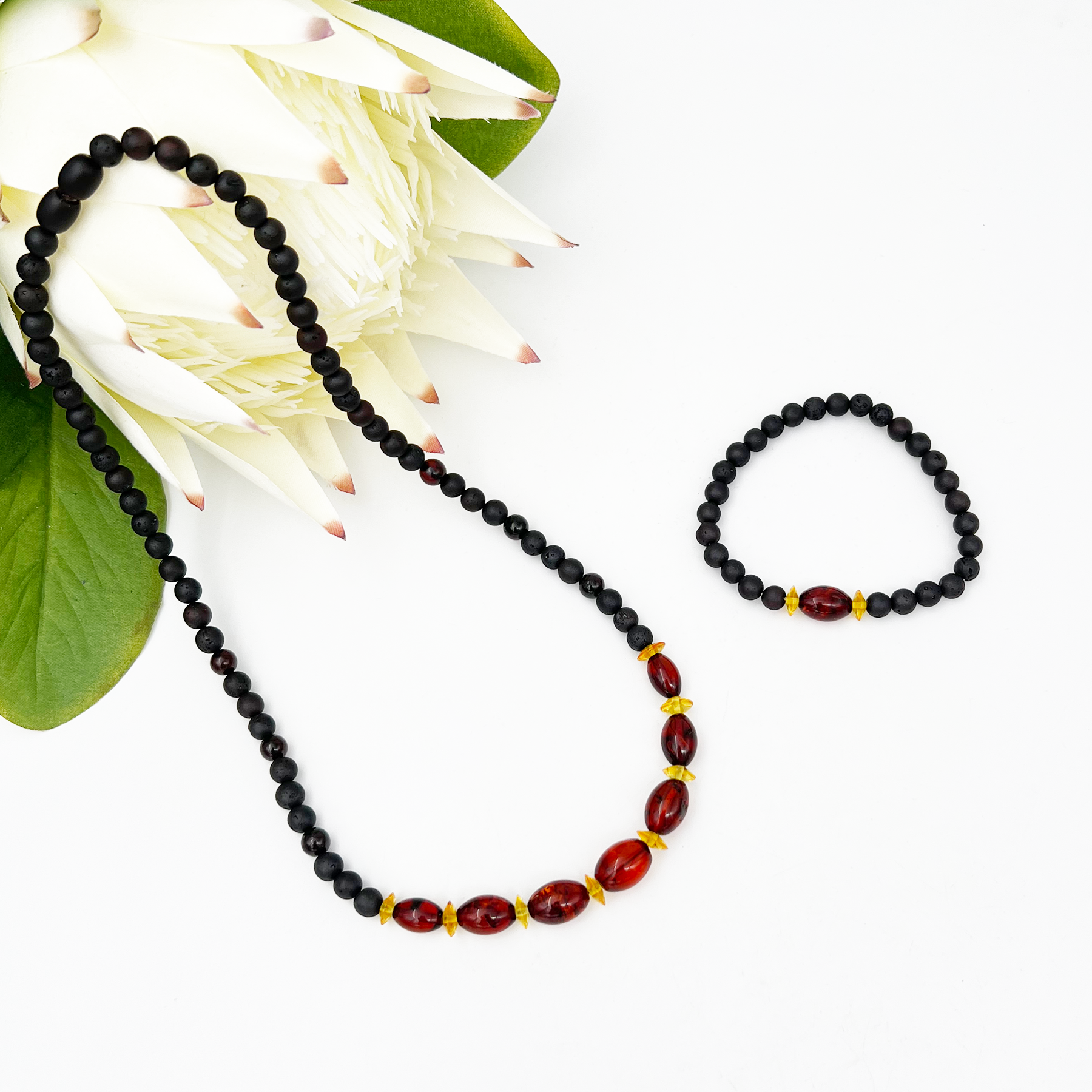 Amber necklace with bracelet "Pupa berry"