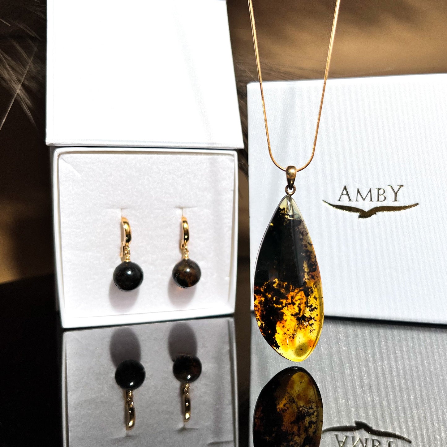Black amber set with gilded silver 925 "Light in the Night"
